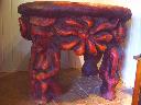stół z jednolitego drewna,nogi w kształcie baśniowych postaci,zdobienia